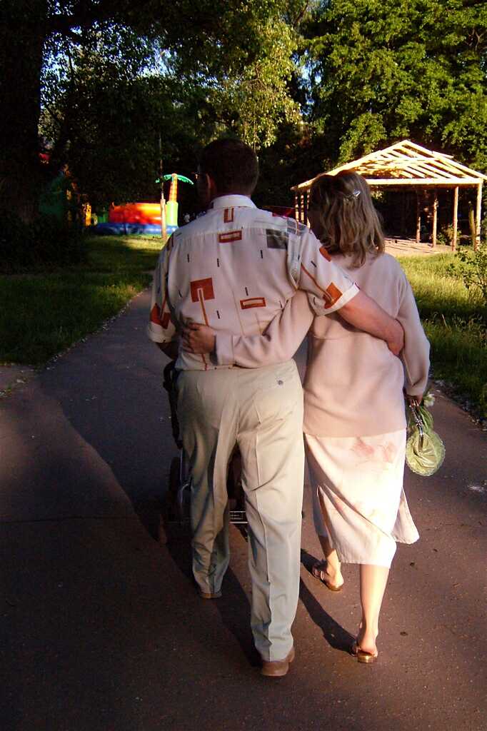Happy couple strolling into the sunset